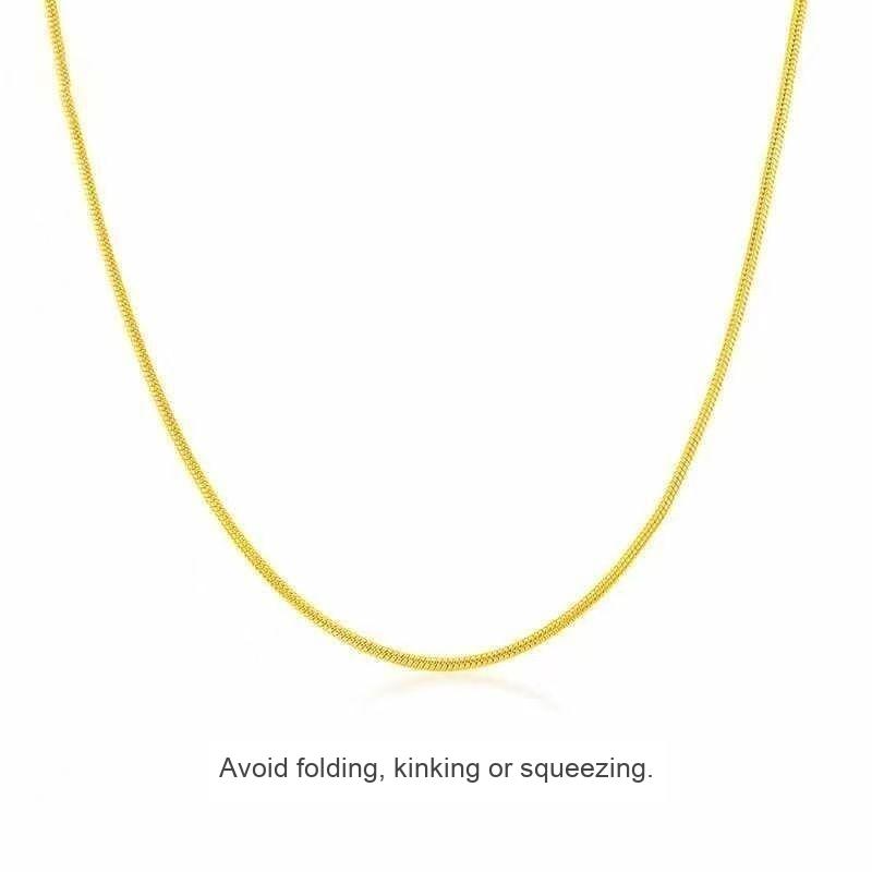 Gold-tone snake chain necklace, 45 cm; avoid folding, kinking or squeezing the chain