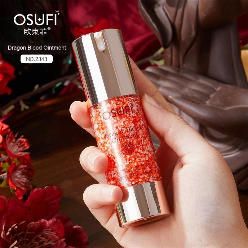 Hand-held OSUFI Dragon Blood Ointment No. 2343 pump bottle with original packaging labels