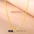 Fine gold-tone star-link necklace, 45 cm, shown worn at the neckline; no gold-purity claim is made