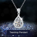 Teardrop pendant with a faceted clear stone-style centre and decorative halo
