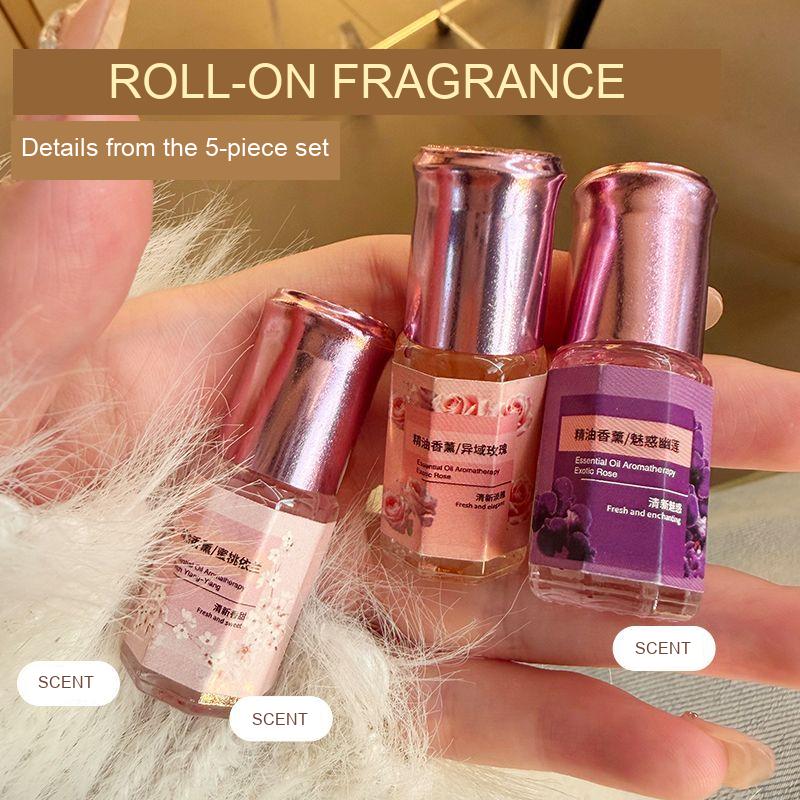 Roll-on fragrance packaging examples from a five-piece set, including floral-labelled bottles