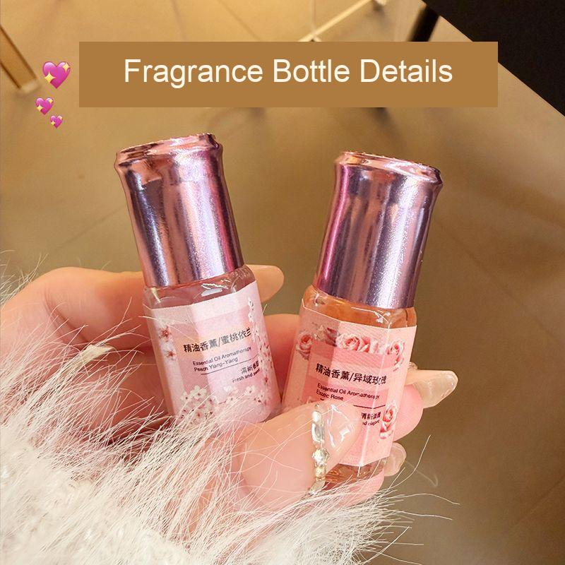 Two capped fragrance bottles with pink labels, shown as packaging details from the five-piece set