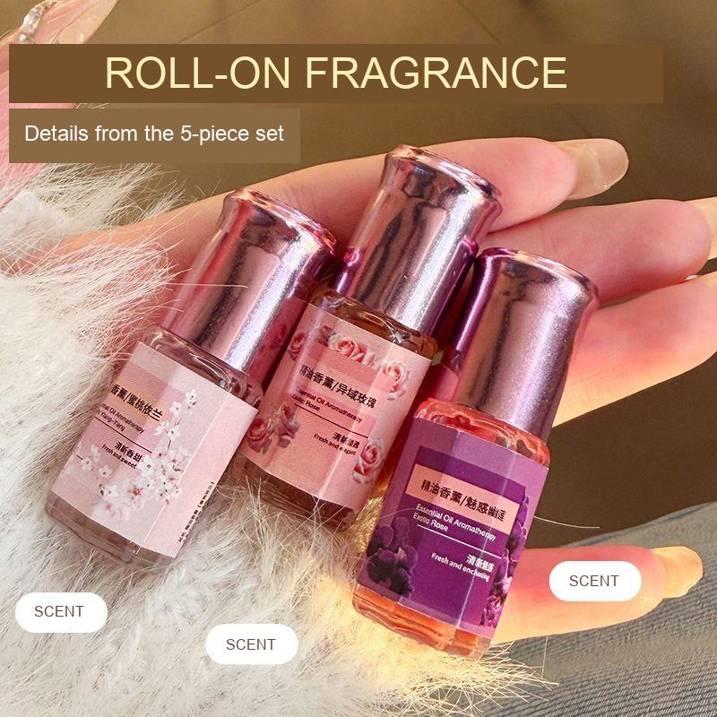 Three fragrance bottles shown as packaging details from the selected five-piece roll-on fragrance set